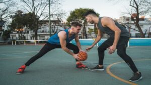 Two basketball players competing in a match showcasing gaming updates from etruesports etruegames, dynamic sports action scene